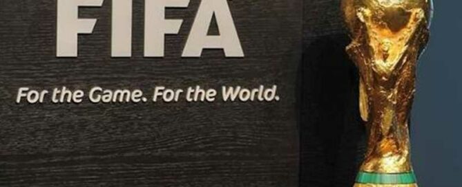 a trophy on a black surface - FIFA World Cup.