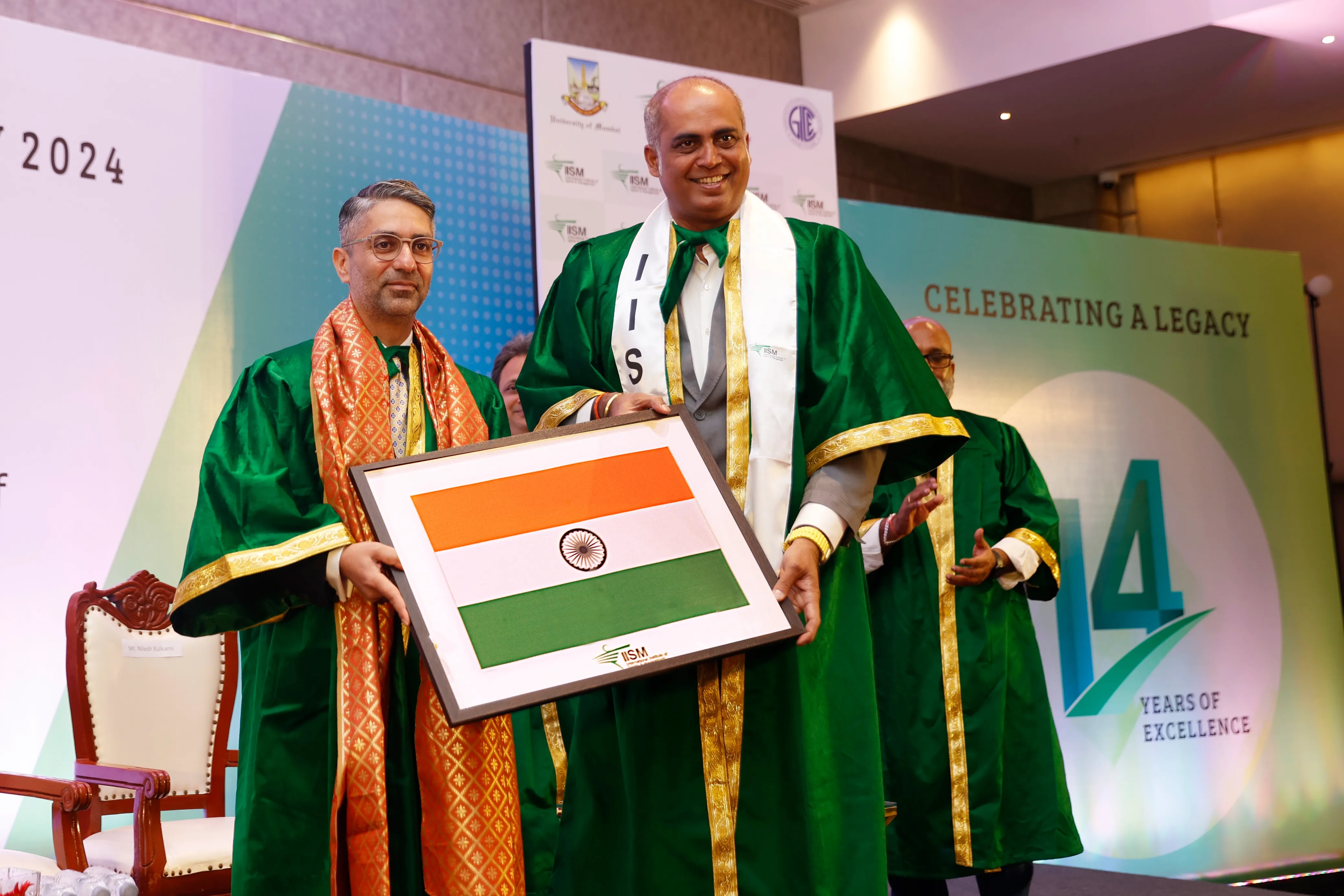 Mr. Nilesh Kulkarni Felicitating Shri. Abhinav Bindra with National Flag